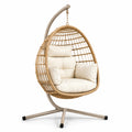 Sillón colgante de ratán con cojines crema, 130cm alto x 95cm ancho x 105cm profundo